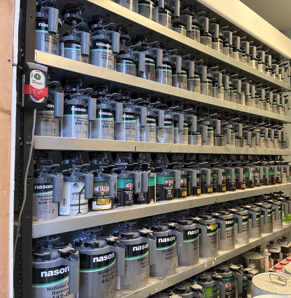 Paint mixing shelves inside Pettie's Auto Body shop in Athens, Alabama