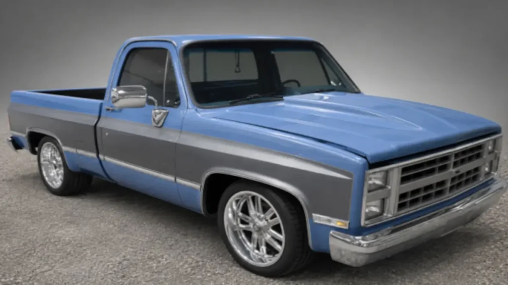 Light blue and gray Chevrolet squarebody pickup photographed after body and paint work.