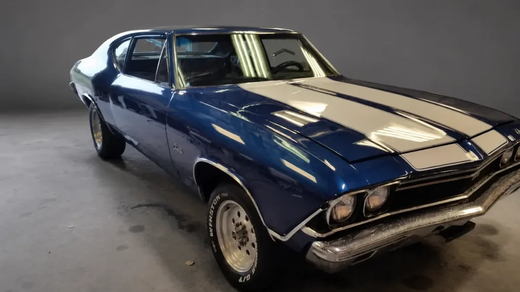 Blue Chevrolet Chevelle with white racing stripes after custom body and paint work by Pettie's Auto Body.