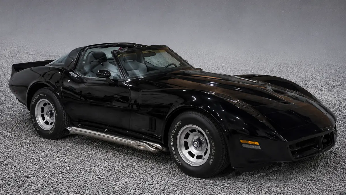 Classic black Chevrolet Corvette after body restoration and custom paint by Pettie's Auto Body.