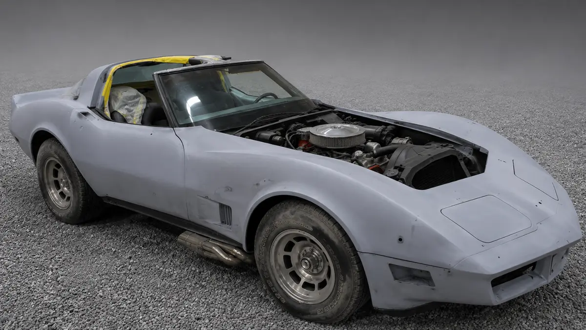 Classic Chevrolet Corvette in gray primer before restoration and custom paint at Pettie's Auto Body.