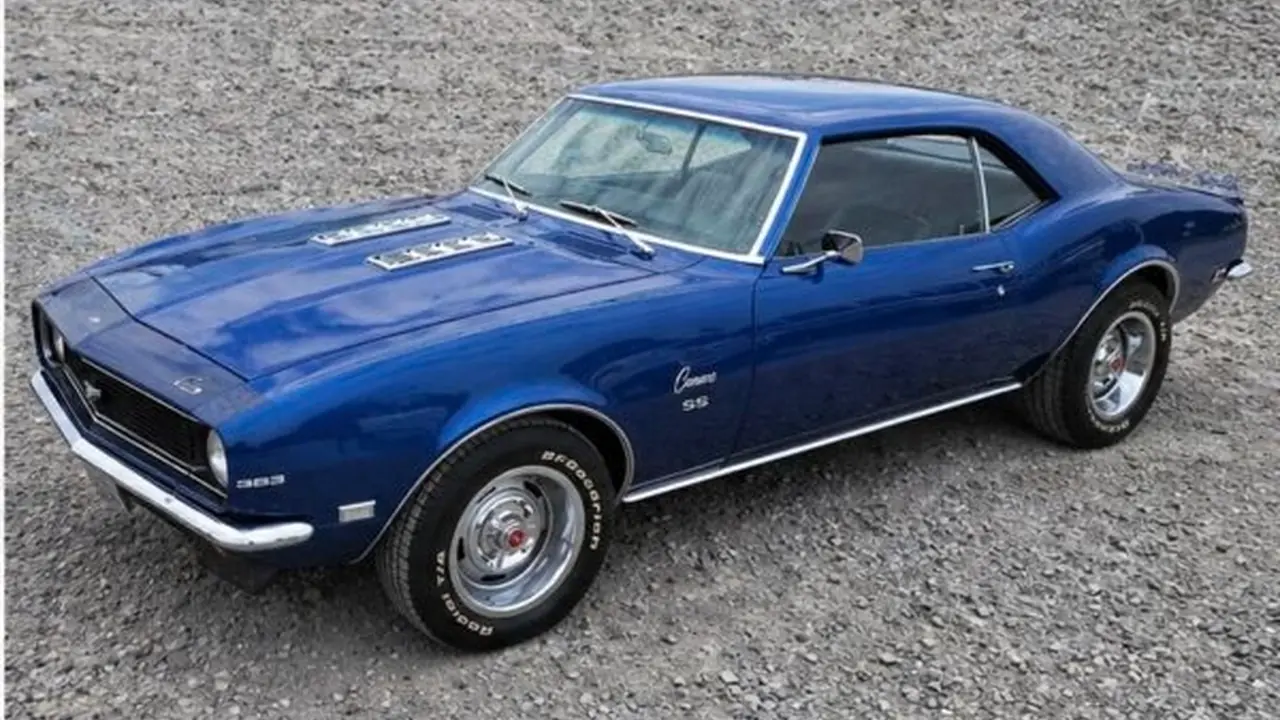 Blue classic Chevrolet Camaro after restoration and custom paint by Pettie's Auto Body in Athens, Alabama.